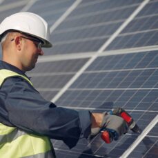 man-with-white-helmet-near-solar-panel (1) (1)